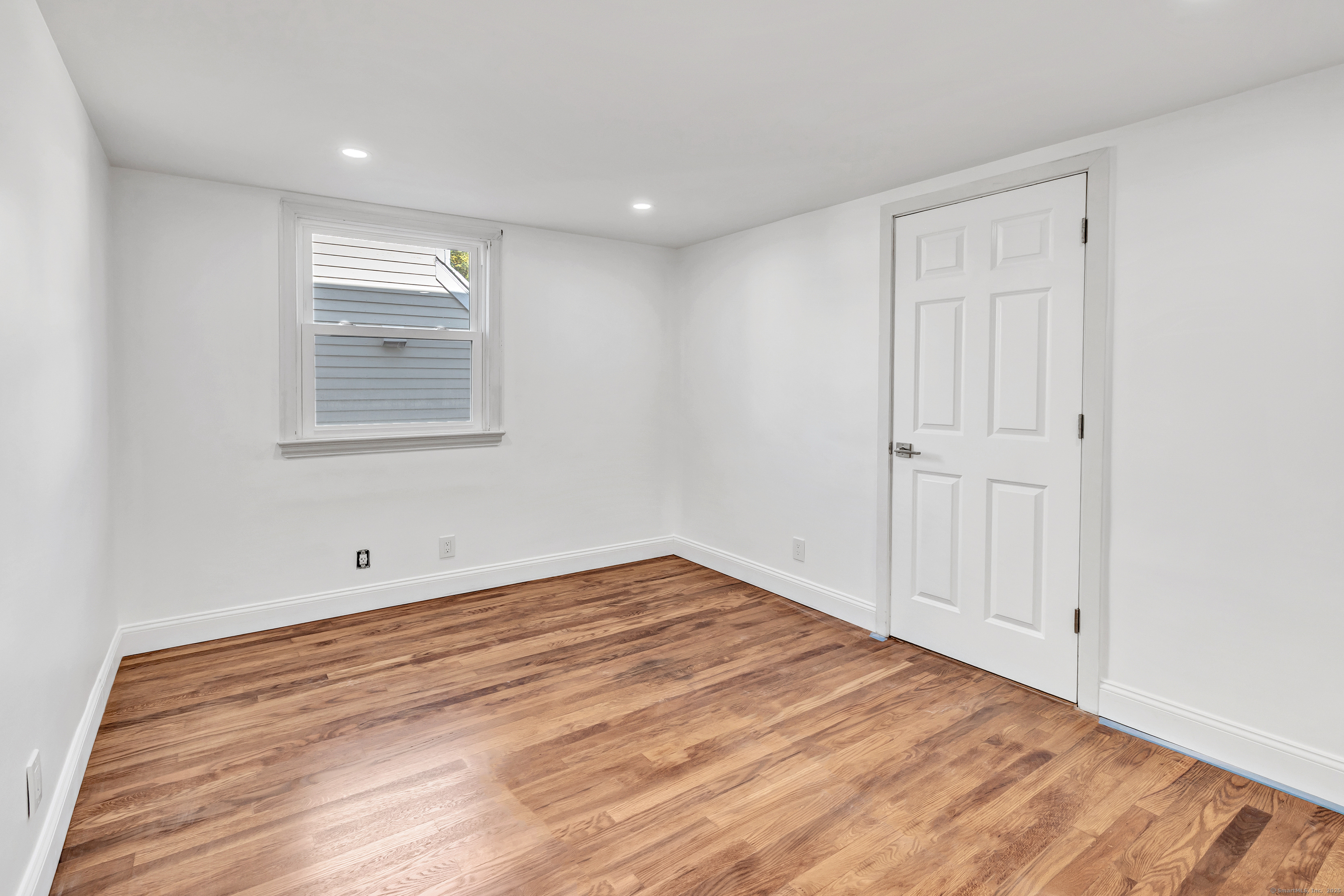14 Fairview Avenue, Unit B Norwalk, CT 06850 - Photo 26 of 31 a view of empty room with wooden floor
