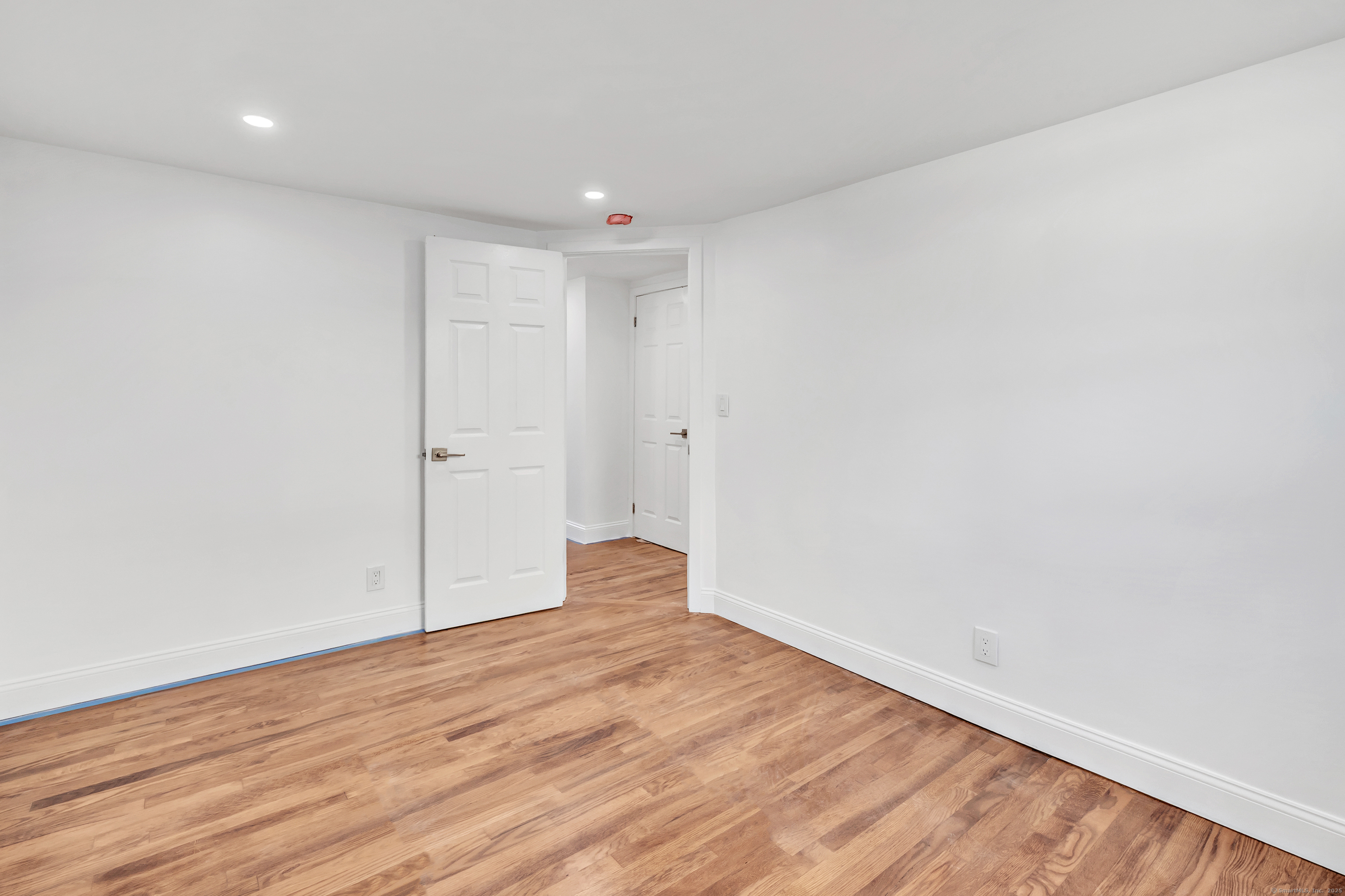14 Fairview Avenue, Unit B Norwalk, CT 06850 - Photo 27 of 31 a view of an empty room with wooden floor