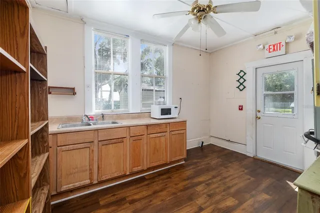 a kitchen with sink cabinets and window