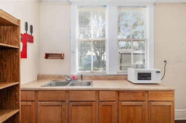 a kitchen with a sink and a window