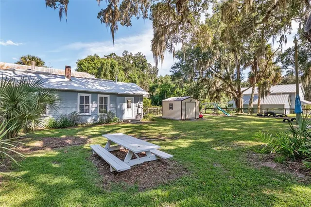 a view of a house with a yard and plants