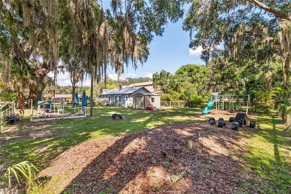 a view of backyard with green space