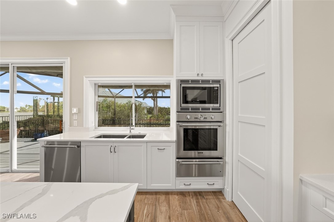 1537 Sand Castle Road Sanibel, FL 33957 - Photo 13 of 50 a kitchen with a stove oven and a window