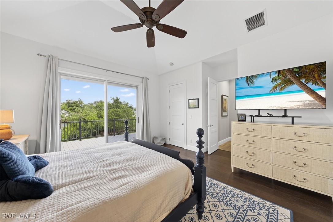 1537 Sand Castle Road Sanibel, FL 33957 - Photo 15 of 50 a bedroom with a bed and a large window