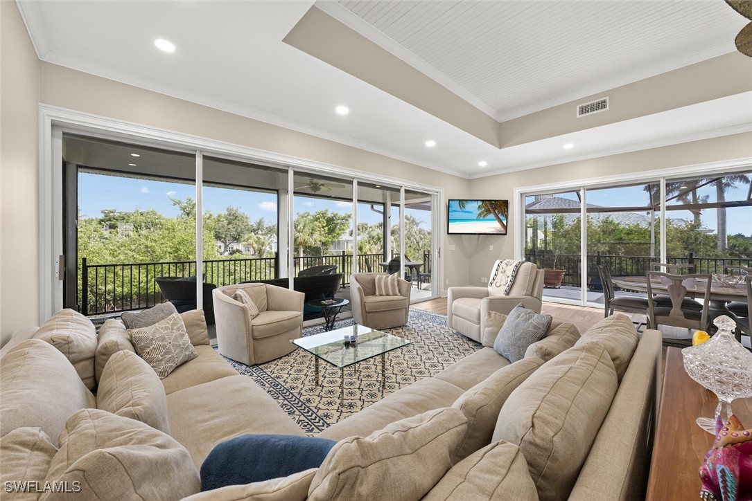 1537 Sand Castle Road Sanibel, FL 33957 - Photo 3 of 50 a living room with furniture and a large window