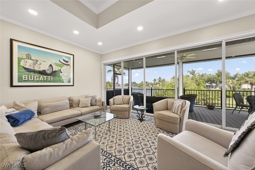 1537 Sand Castle Road Sanibel, FL 33957 - Photo 4 of 50 a living room with furniture large windows and a rug