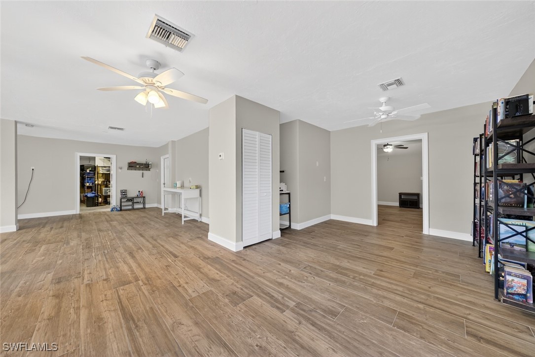 1537 Sand Castle Road Sanibel, FL 33957 - Photo 46 of 50 a view of empty room with wooden floor and ceiling fan