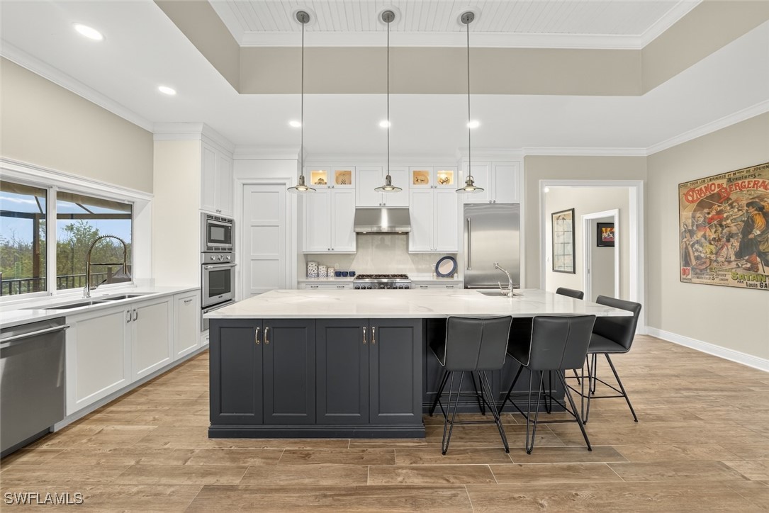 1537 Sand Castle Road Sanibel, FL 33957 - Photo 10 of 50 a large kitchen with a table and chairs