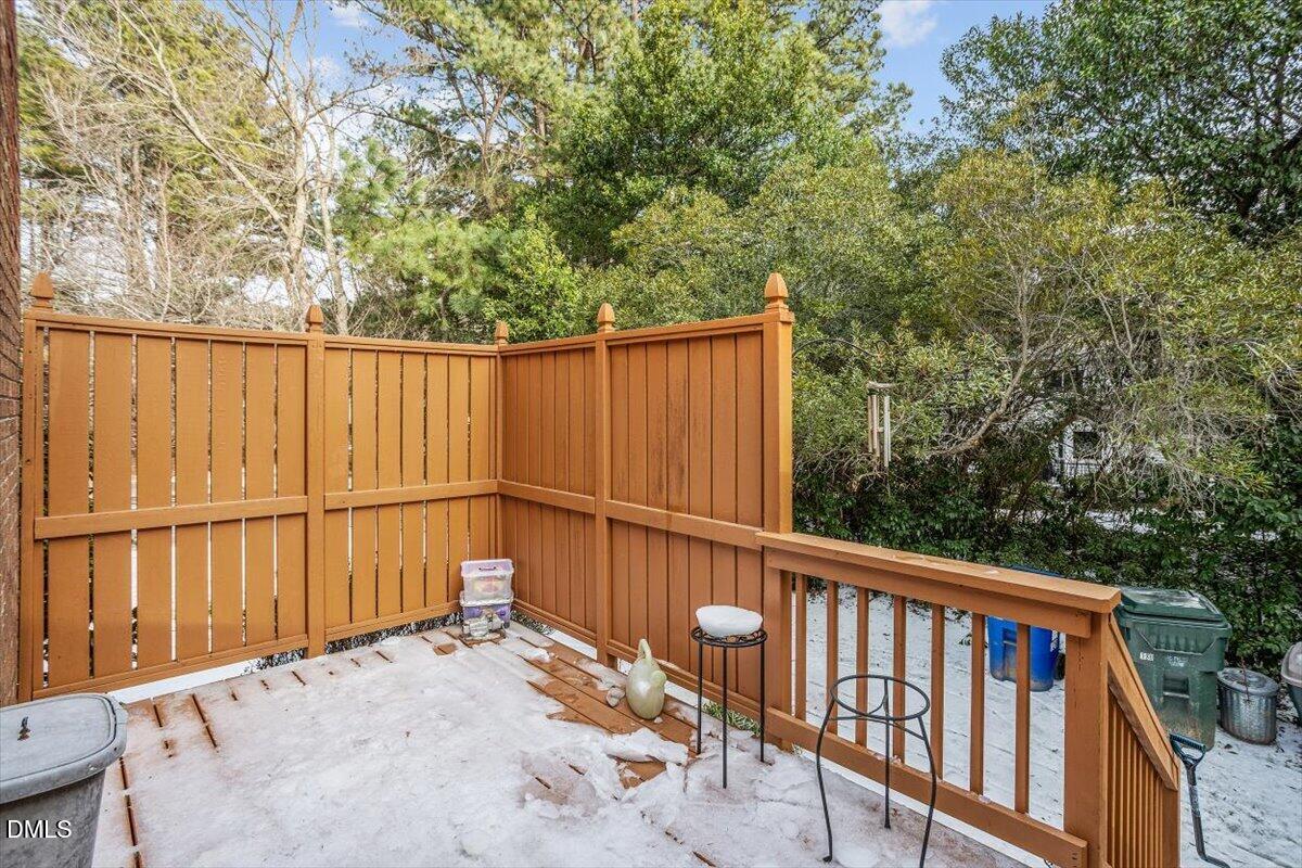 126 Skylark Way Raleigh, NC 27615 - Photo 4 of 25 Back deck off living room with landscaping for privacy