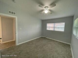 305 Prospect Avenue Cocoa, FL 32922 - Photo 15 of 25 an empty room with windows and fan