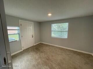 305 Prospect Avenue Cocoa, FL 32922 - Photo 19 of 25 an empty room with windows