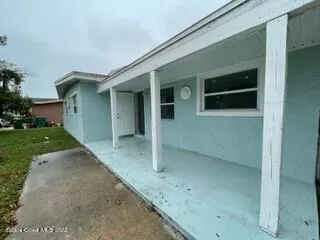 a view of a garden with a house