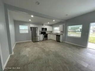 a view of a kitchen with a sink and an oven
