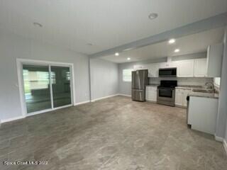 305 Prospect Avenue Cocoa, FL 32922 - Photo 5 of 25 a view of a kitchen with a sink and an oven