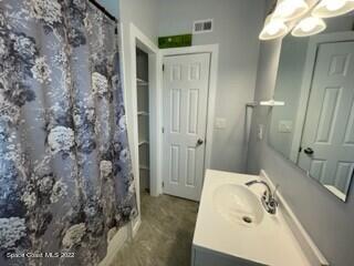 305 Prospect Avenue Cocoa, FL 32922 - Photo 7 of 25 a bathroom with a sink and a mirror