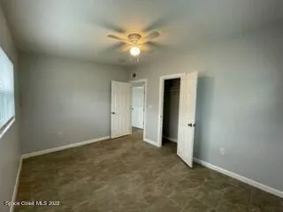 a view of an empty room with a bathroom