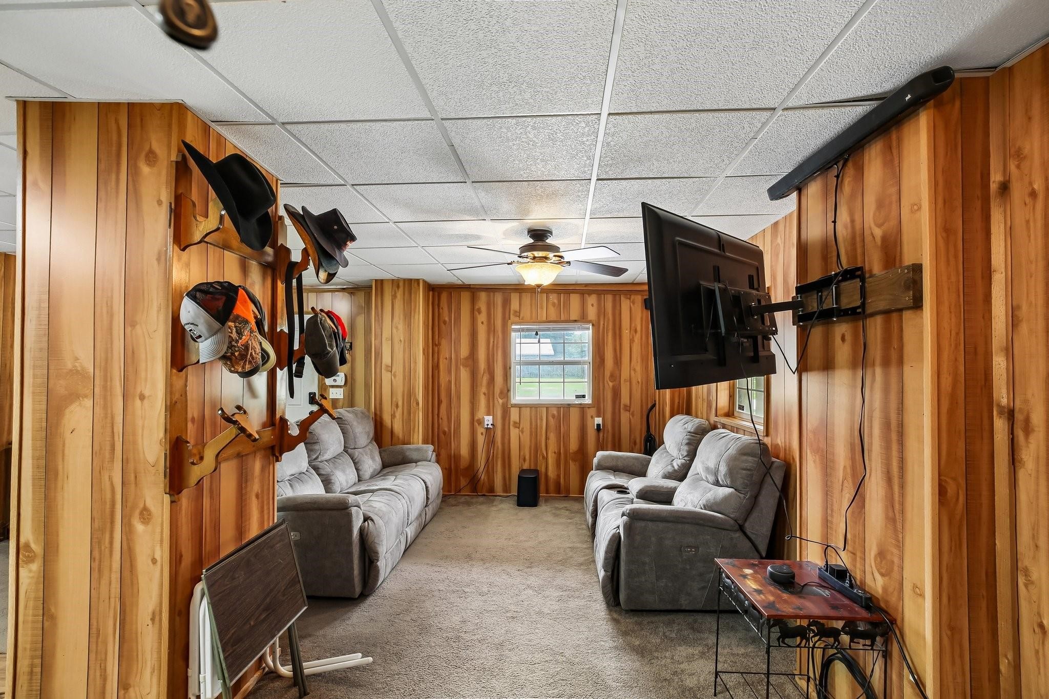 164 Frank Road Trinity, TX 75862 - Photo 19 of 20 19. This versatile secondary living area offers additional flexibility for your lifestyle, whether you need a dedicated home office, a hobby room, or an extra den. The warm wood tones and large windows create a bright, comfortable space that easily adapts to your family's needs.