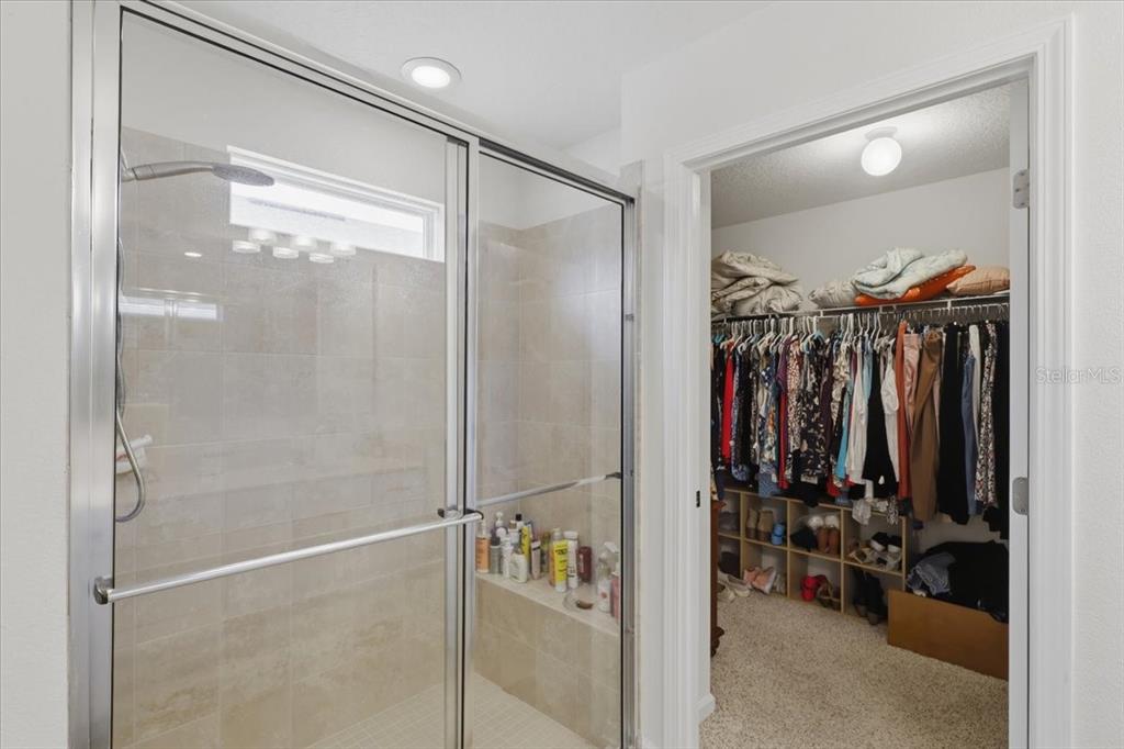 35 Birdie Way Bunnell, FL 32110 - Photo 36 of 57 a walk in closet with a glass door shower