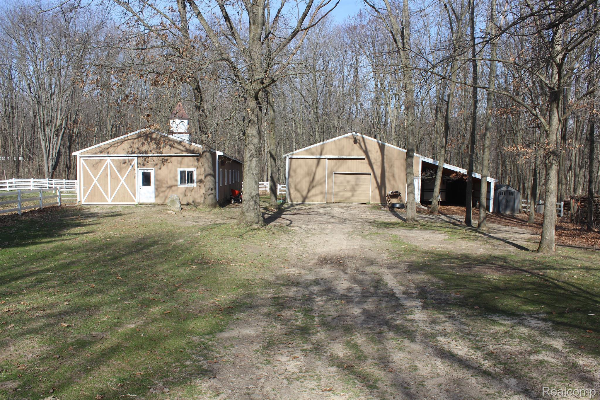 6875 Farley Road Pinckney, MI 48169 - Photo 35 of 53 Horse barn with 6 stalls and equipment barn.