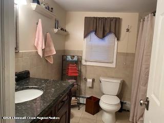 67 Paint Island Spring Road Clarksburg, NJ 08510 - Photo 8 of 8 a bathroom with a granite countertop sink and a toilet
