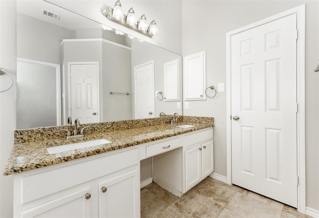 9507 Landmark Place Frisco, TX 75035 - Photo 16 of 18 a bathroom with a granite countertop sink and a mirror