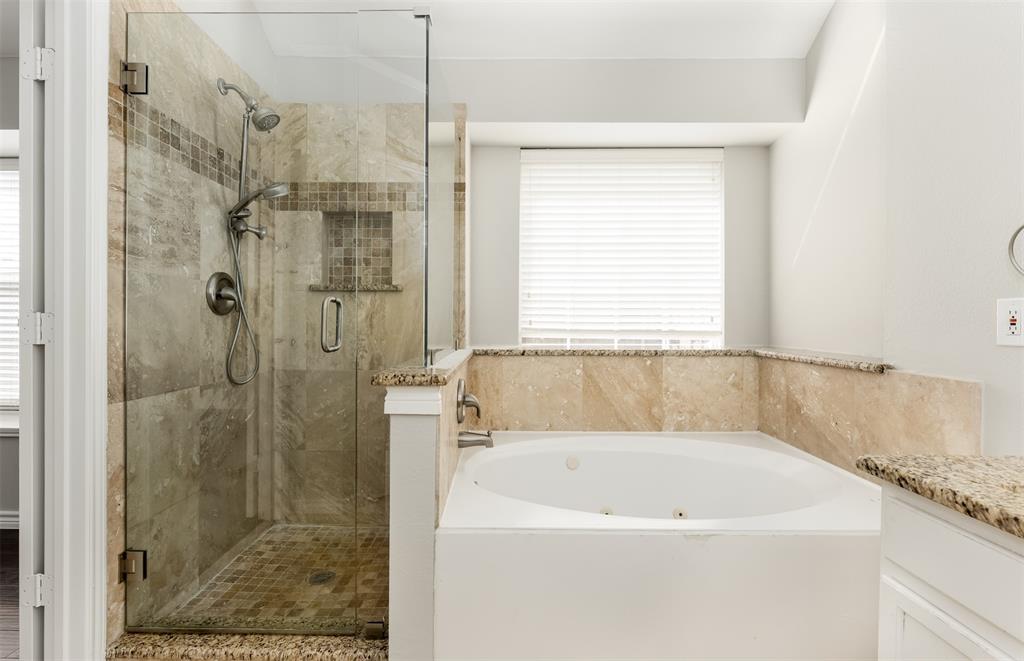 9507 Landmark Place Frisco, TX 75035 - Photo 17 of 18 a bath tub sitting next to a shower