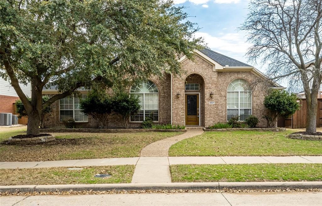 9507 Landmark Place Frisco, TX 75035 - Photo 2 of 18 a front view of a house with a yard