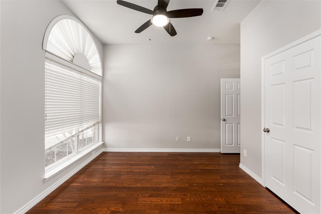 9507 Landmark Place Frisco, TX 75035 - Photo 6 of 18 a view of an empty room with wooden floor and a window