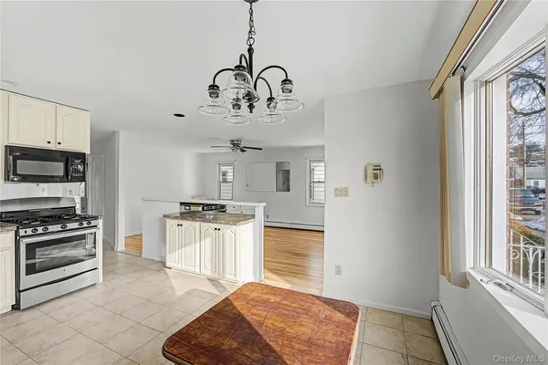 a kitchen with stainless steel appliances granite countertop a stove and a refrigerator