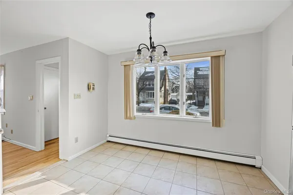 a view of a room with window chandelier