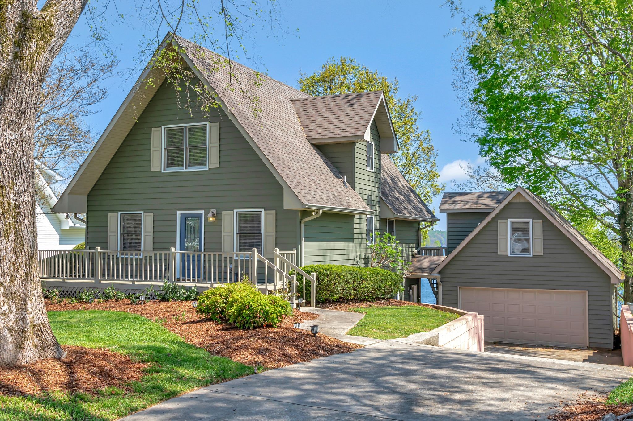 a front view of a house with garden