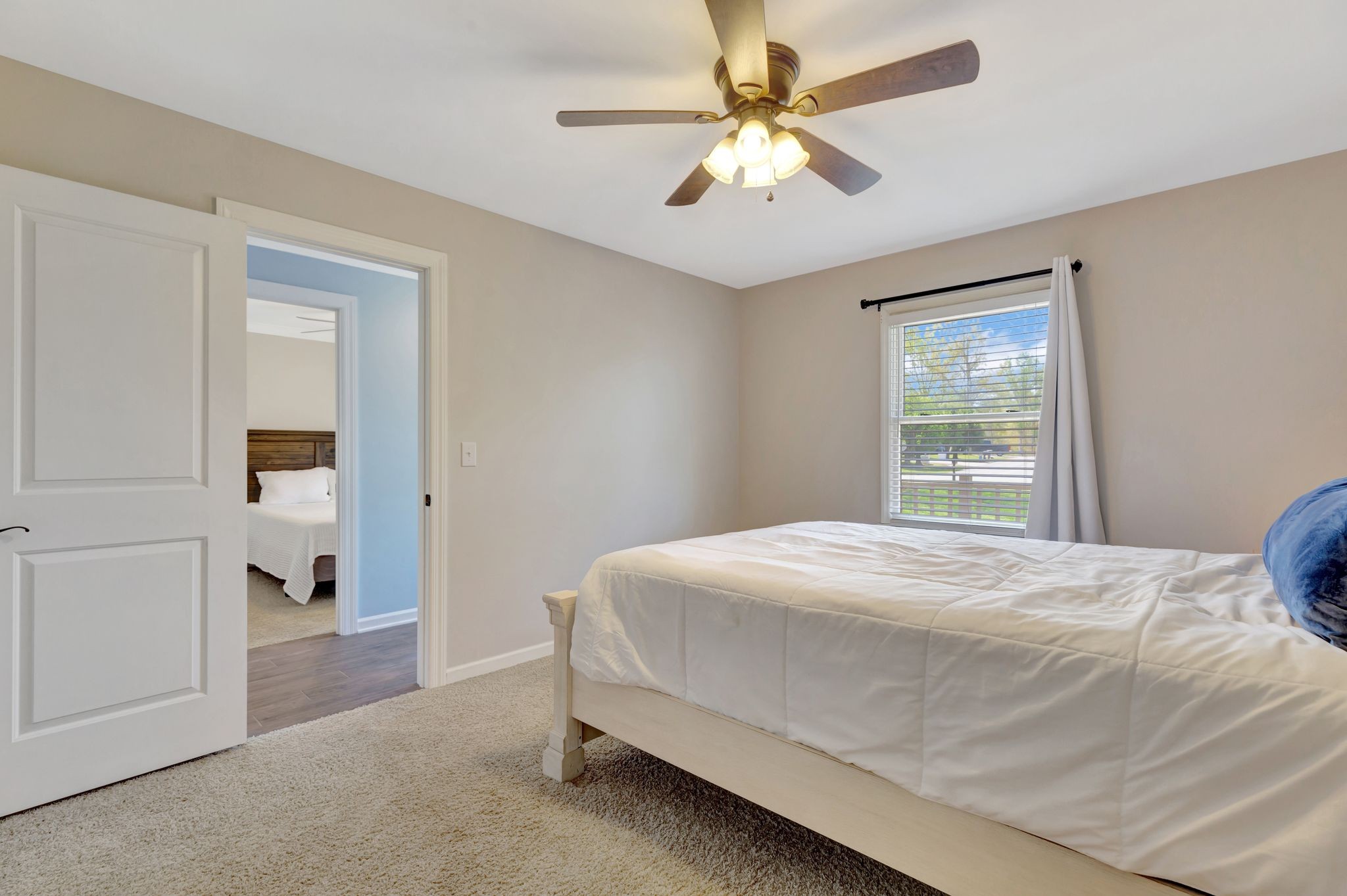 668 Bluff Drive Winchester, TN 37398 - Photo 15 of 55 a bedroom with a bed and a chandelier