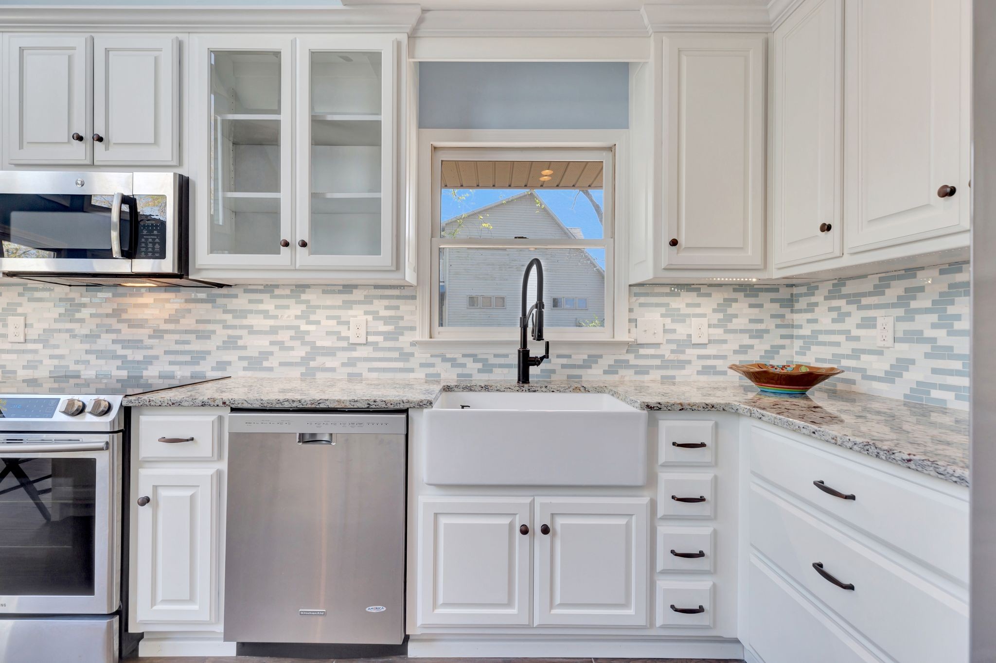 668 Bluff Drive Winchester, TN 37398 - Photo 27 of 55 a kitchen with granite countertop white cabinets and stainless steel appliances