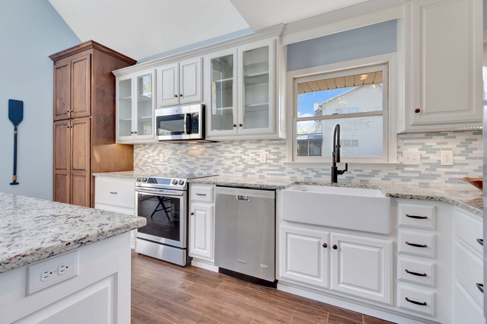 668 Bluff Drive Winchester, TN 37398 - Photo 28 of 55 a kitchen with granite countertop a sink stove and refrigerator