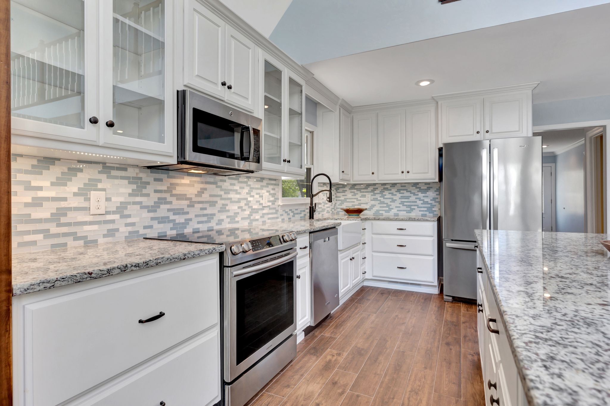 668 Bluff Drive Winchester, TN 37398 - Photo 30 of 55 a kitchen with stainless steel appliances granite countertop a stove a refrigerator and a microwave