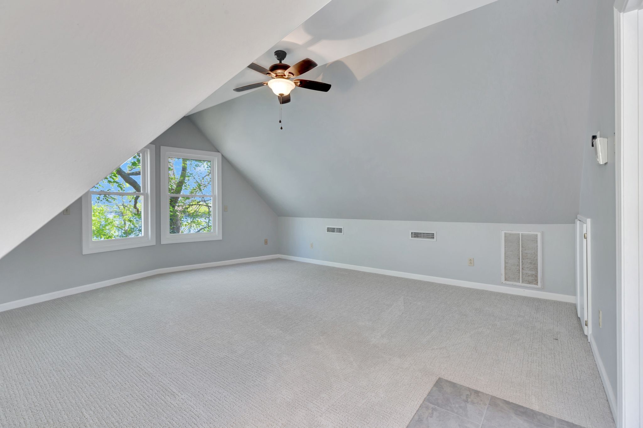 668 Bluff Drive Winchester, TN 37398 - Photo 50 of 55 an empty room with windows and chandelier fan