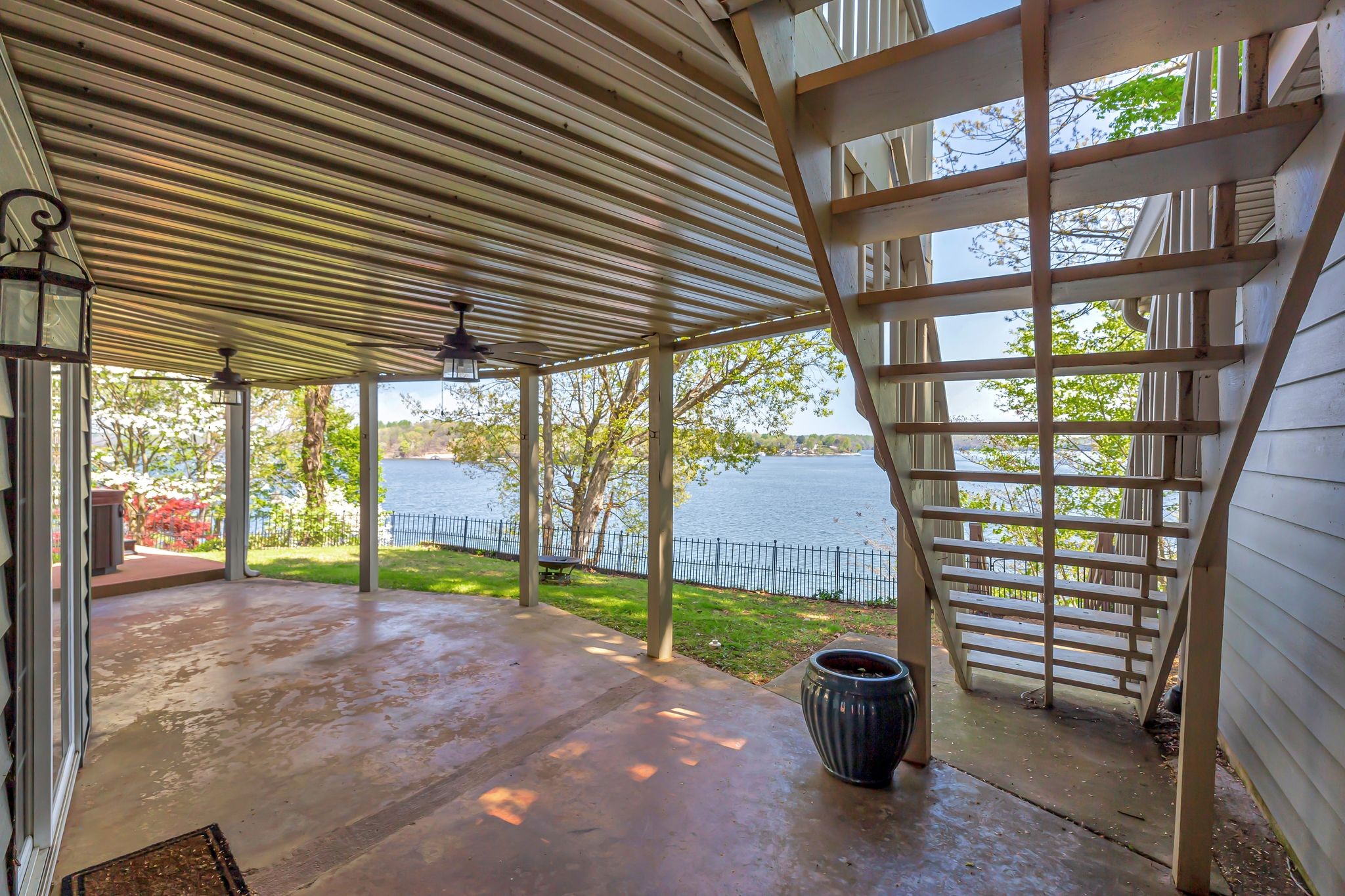 668 Bluff Drive Winchester, TN 37398 - Photo 52 of 55 a view of a porch with a table and chairs and potted plants
