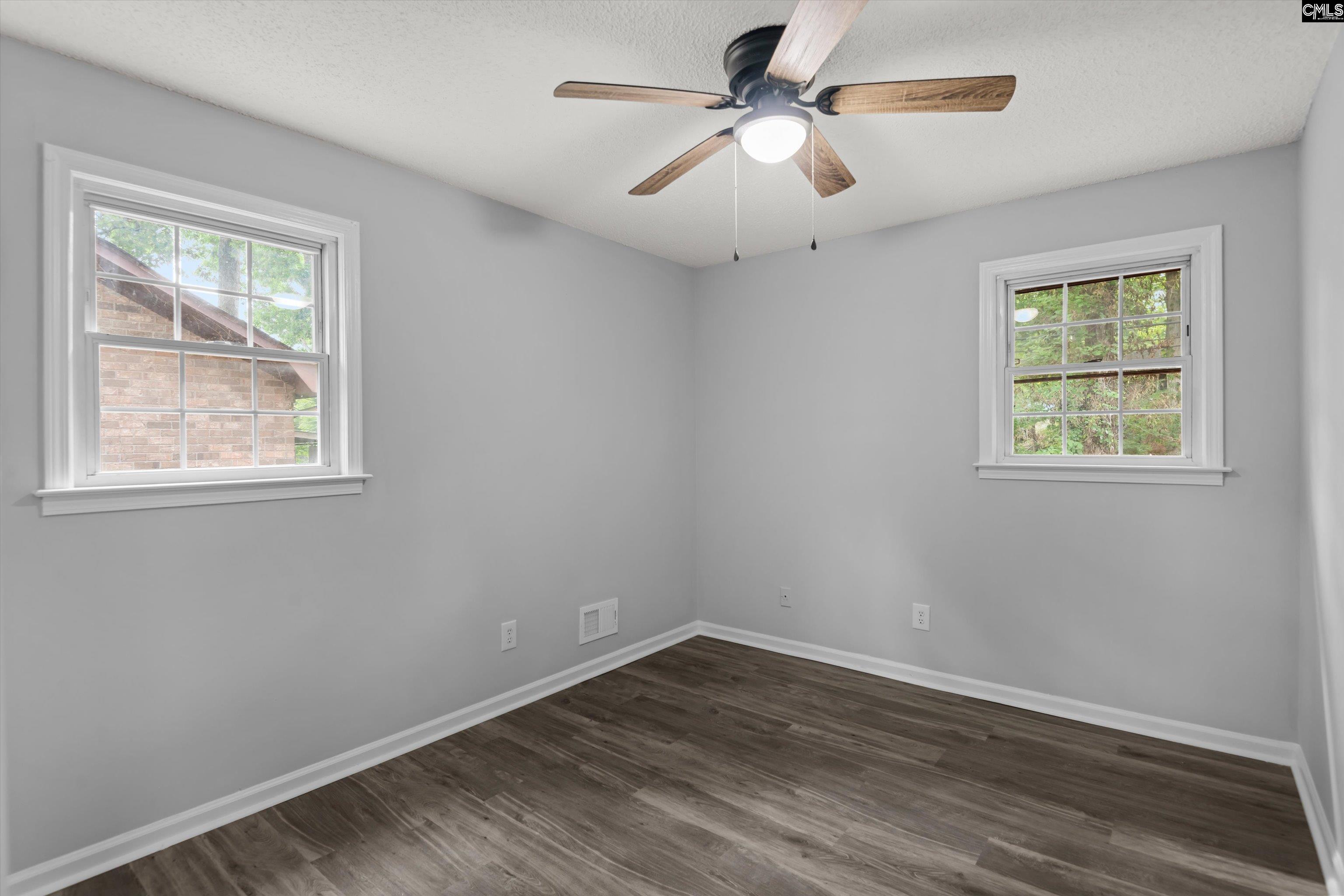 245 Piney Grove Road Columbia, SC 29210 - Photo 21 of 29 a view of empty room with wooden floor and fan