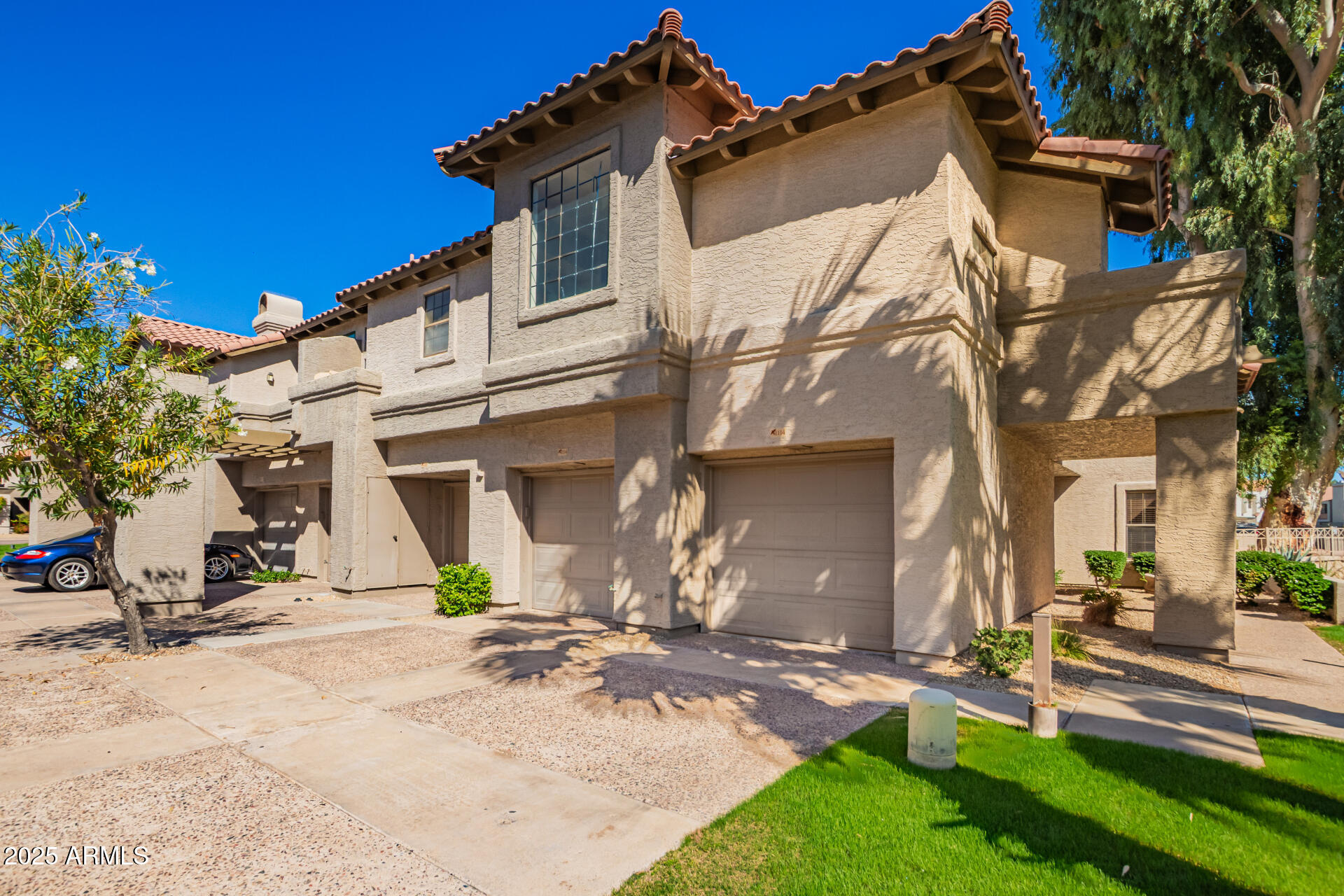 10019 East Mountain View Road, Unit 2114 Scottsdale, AZ 85258 - Photo 1 of 40 a view of a house with yard and sitting area