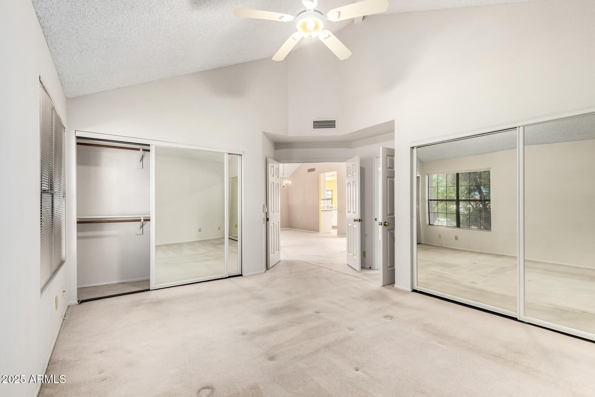 10019 East Mountain View Road, Unit 2114 Scottsdale, AZ 85258 - Photo 17 of 40 a view of a big room with closet and windows