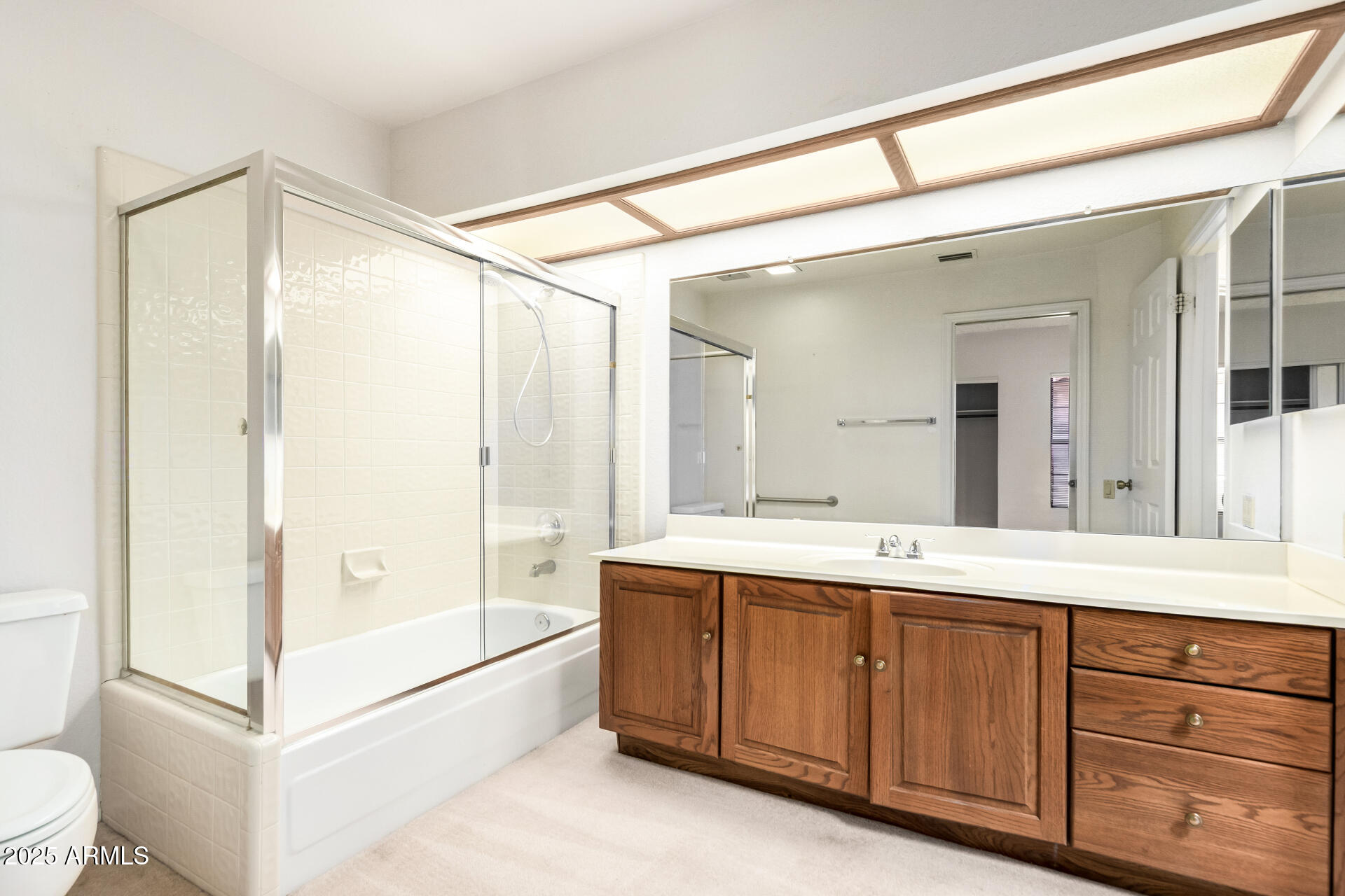 10019 East Mountain View Road, Unit 2114 Scottsdale, AZ 85258 - Photo 22 of 40 a spacious bathroom with a double vanity sink toilet mirror and bathtub