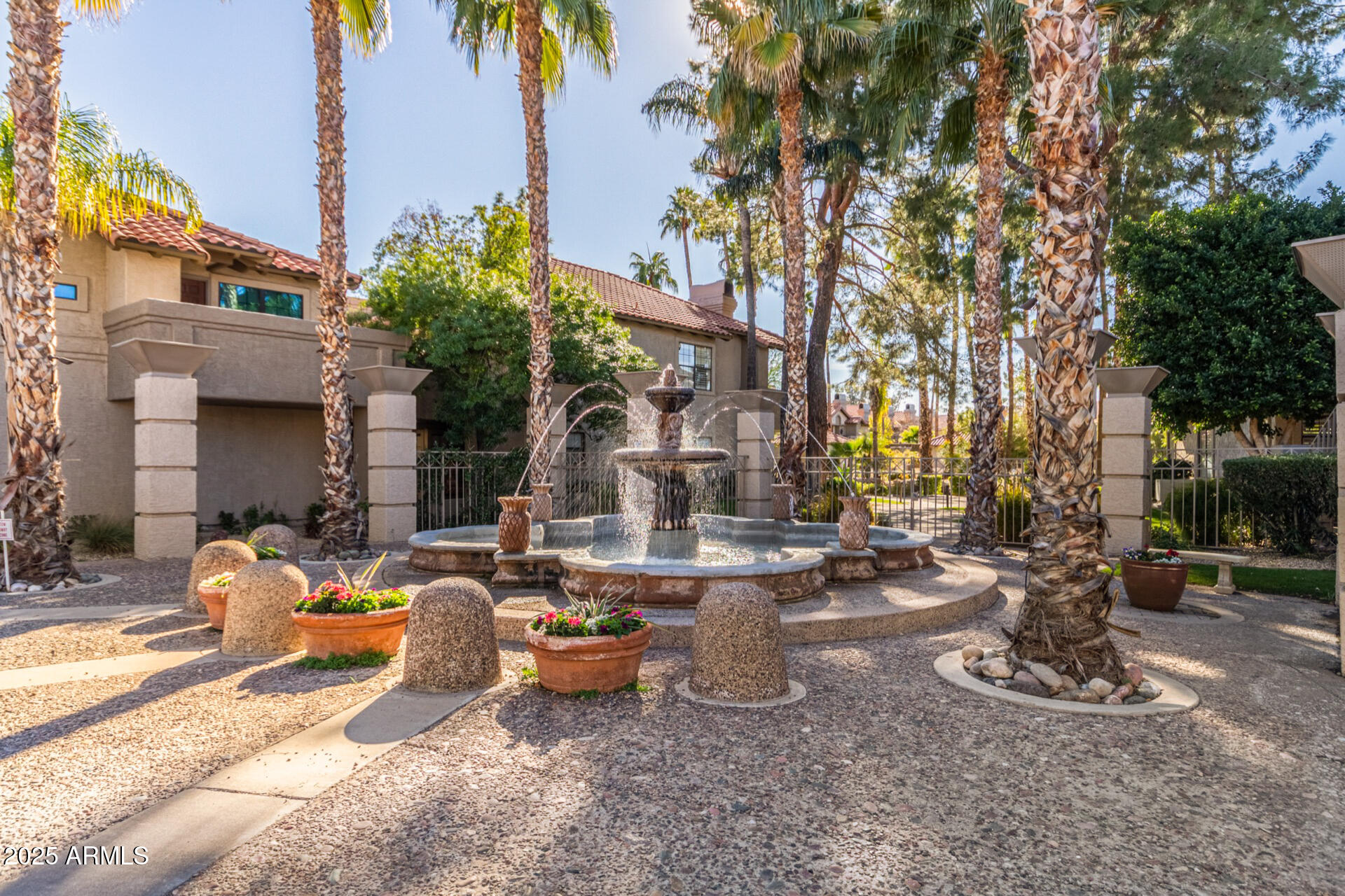 10019 East Mountain View Road, Unit 2114 Scottsdale, AZ 85258 - Photo 29 of 40 a row of palm trees in front of the house