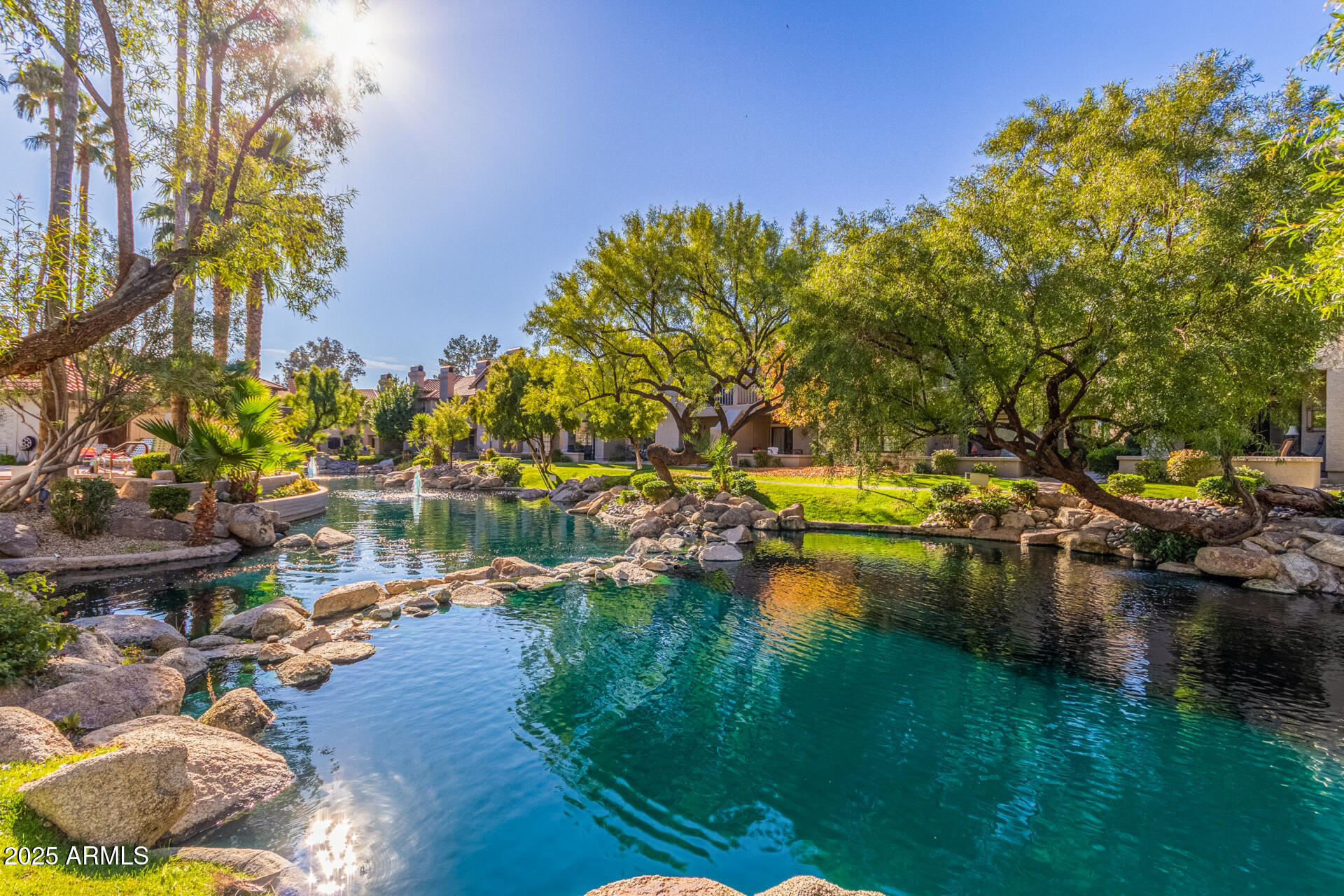 10019 East Mountain View Road, Unit 2114 Scottsdale, AZ 85258 - Photo 30 of 40 a view of a lake with houses