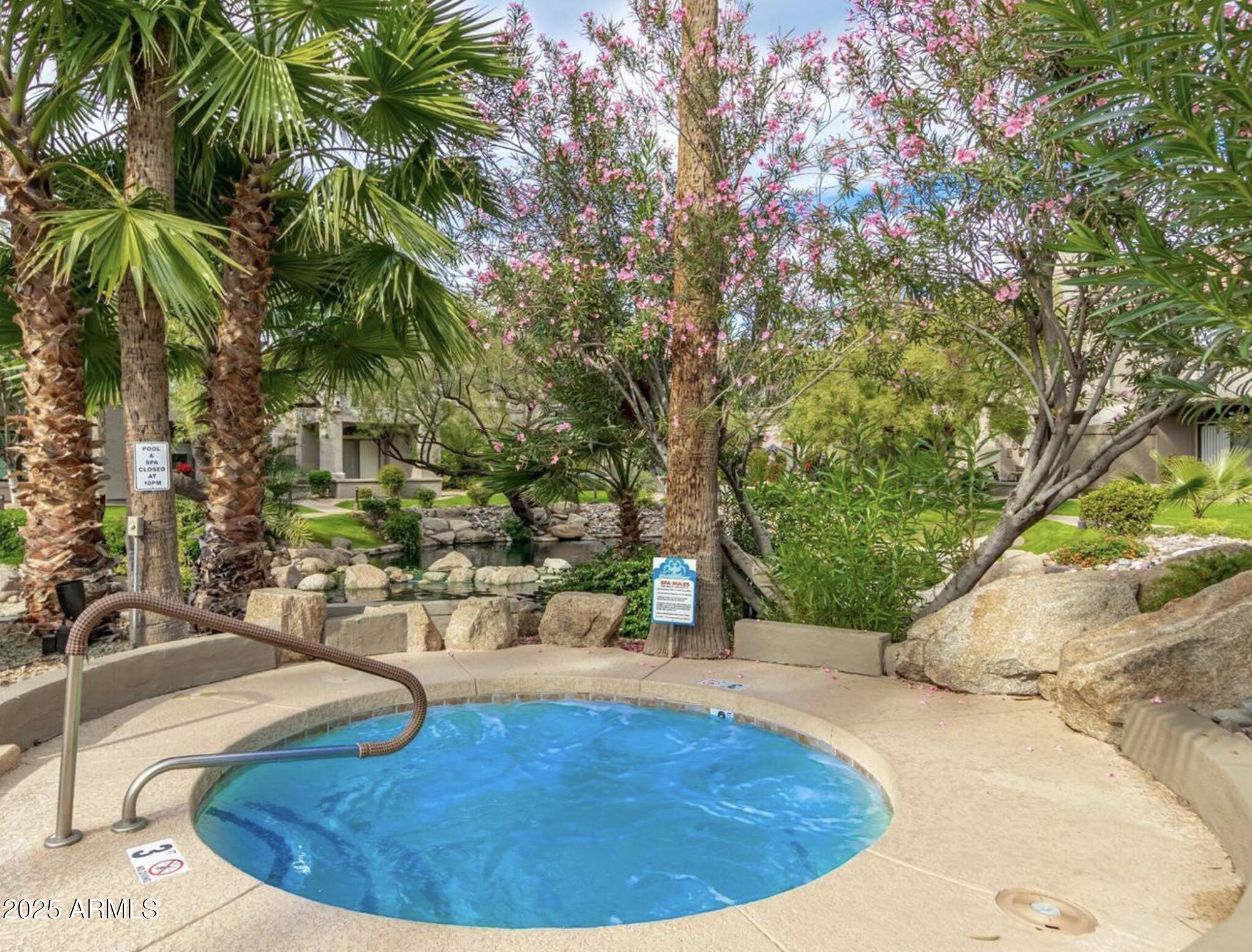 10019 East Mountain View Road, Unit 2114 Scottsdale, AZ 85258 - Photo 31 of 40 a view of a swimming pool with an outdoor seating