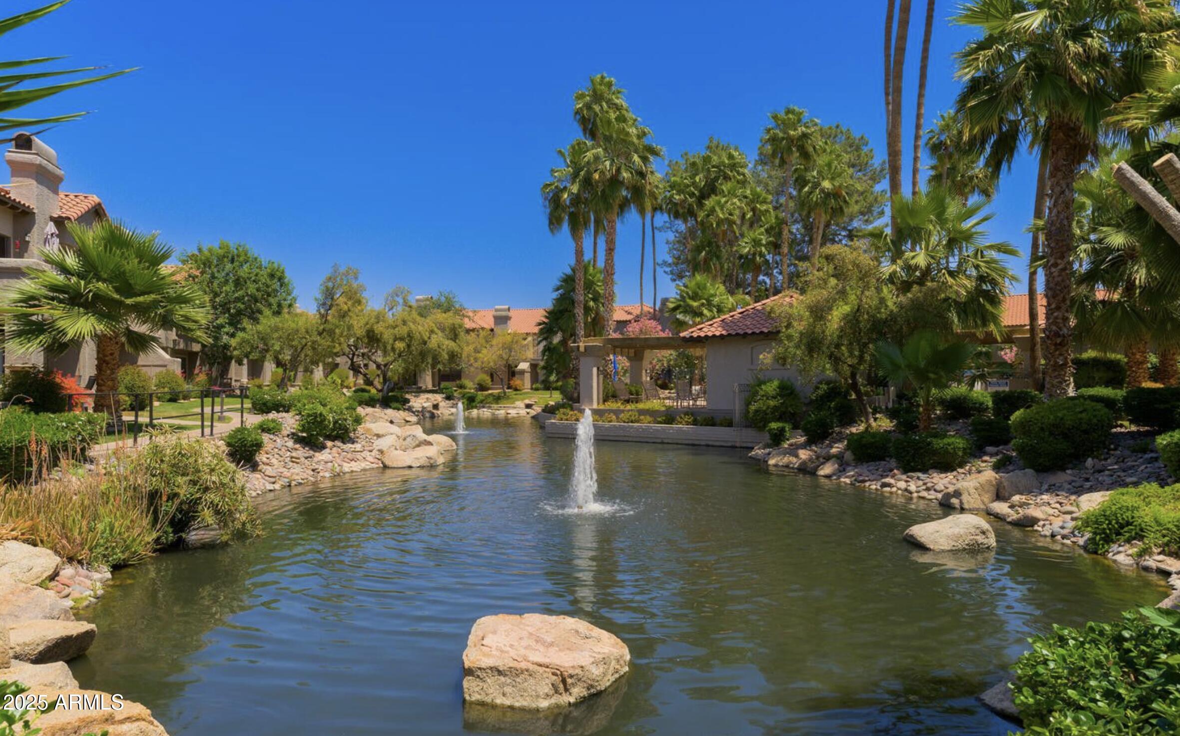 10019 East Mountain View Road, Unit 2114 Scottsdale, AZ 85258 - Photo 35 of 40 a view of a lake with house