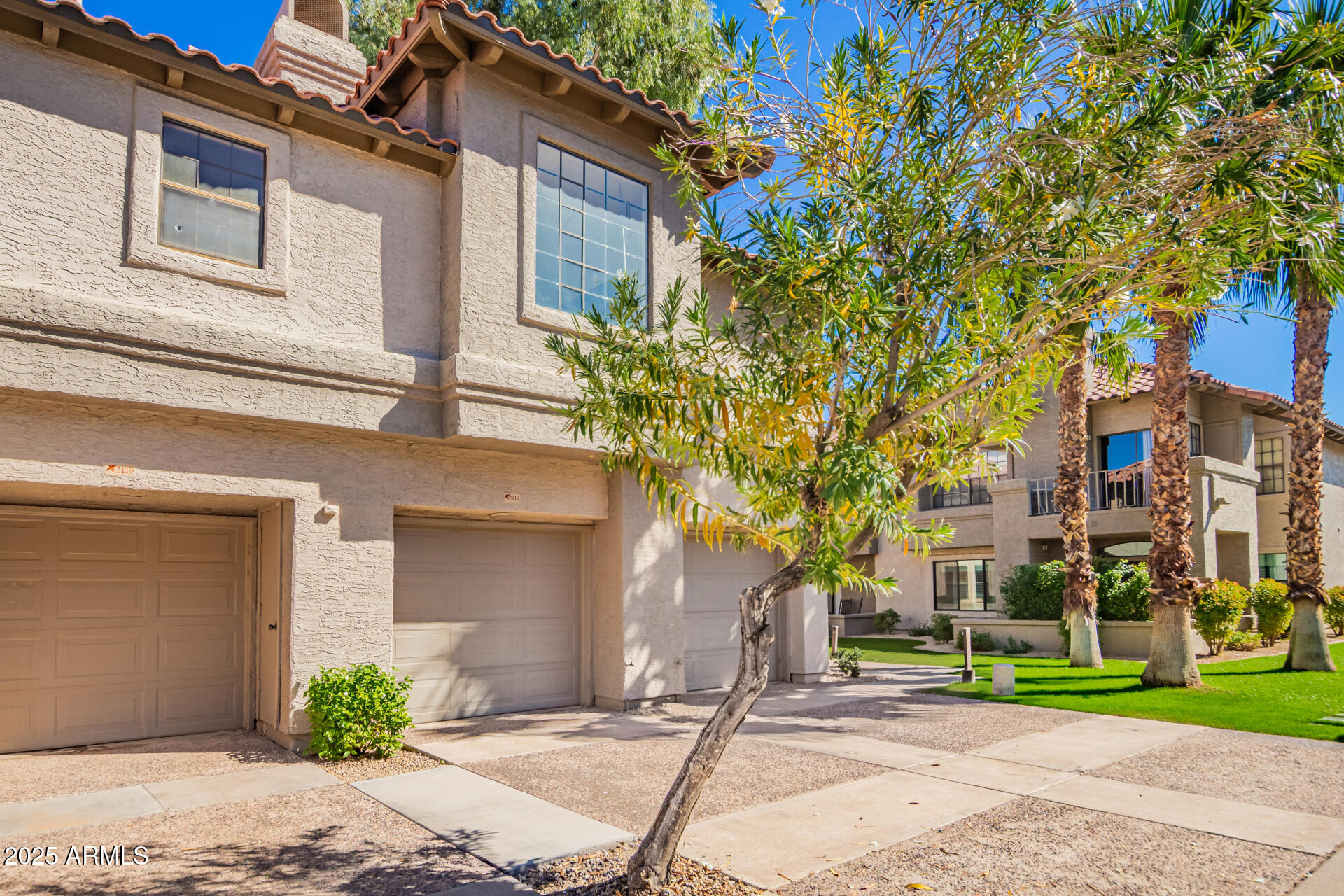 10019 East Mountain View Road, Unit 2114 Scottsdale, AZ 85258 - Photo 36 of 40 a front view of a house with a yard