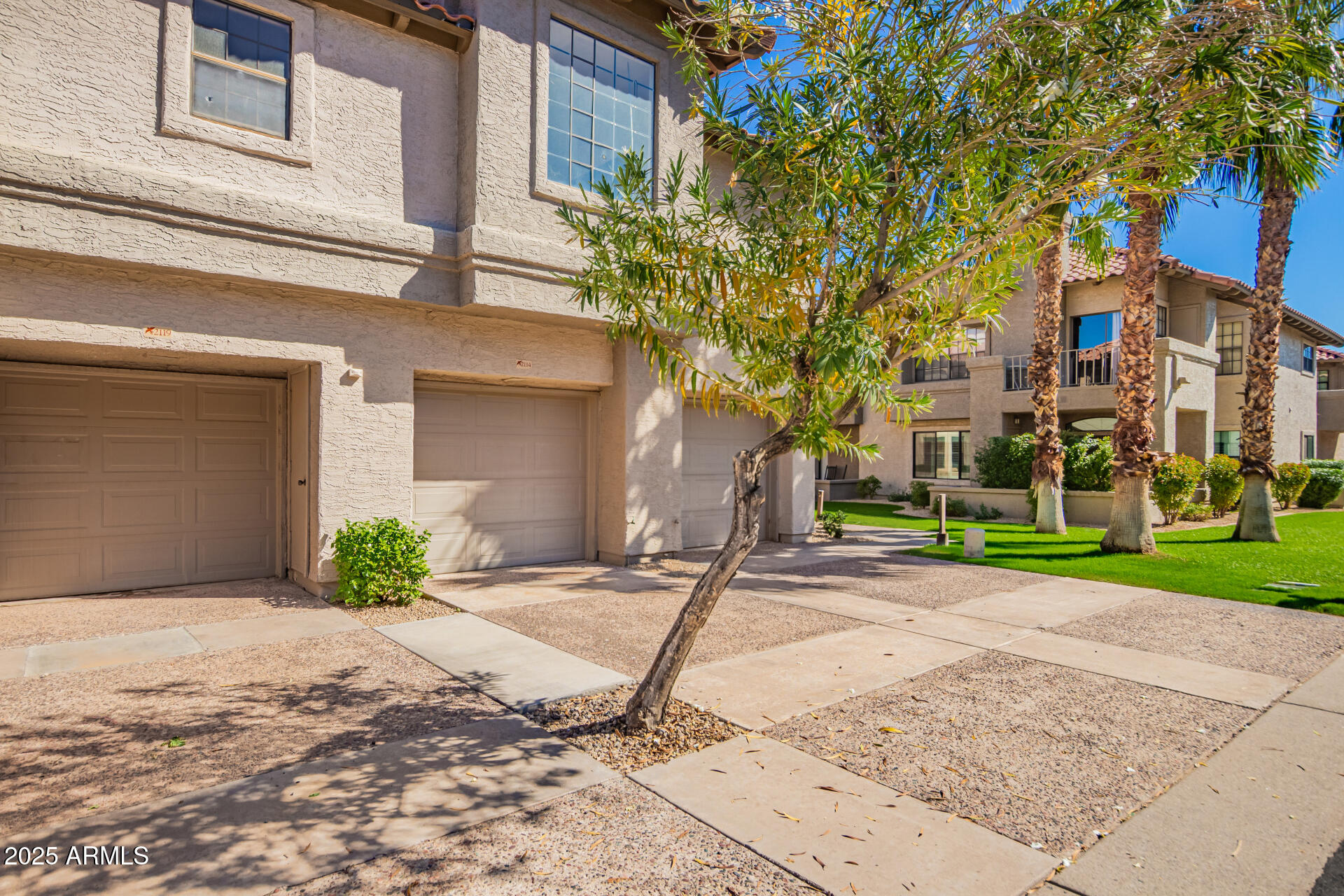 10019 East Mountain View Road, Unit 2114 Scottsdale, AZ 85258 - Photo 38 of 40 a front view of a house with garden