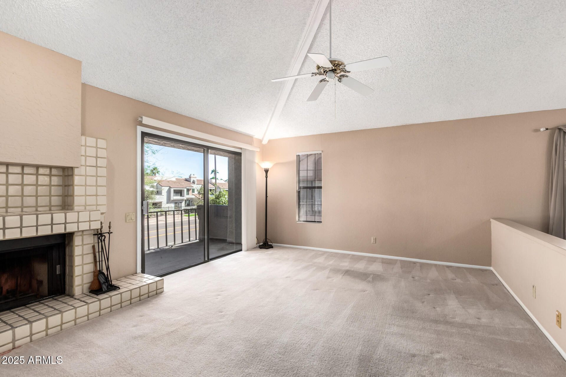 10019 East Mountain View Road, Unit 2114 Scottsdale, AZ 85258 - Photo 5 of 40 a view of livingroom with window and fireplace