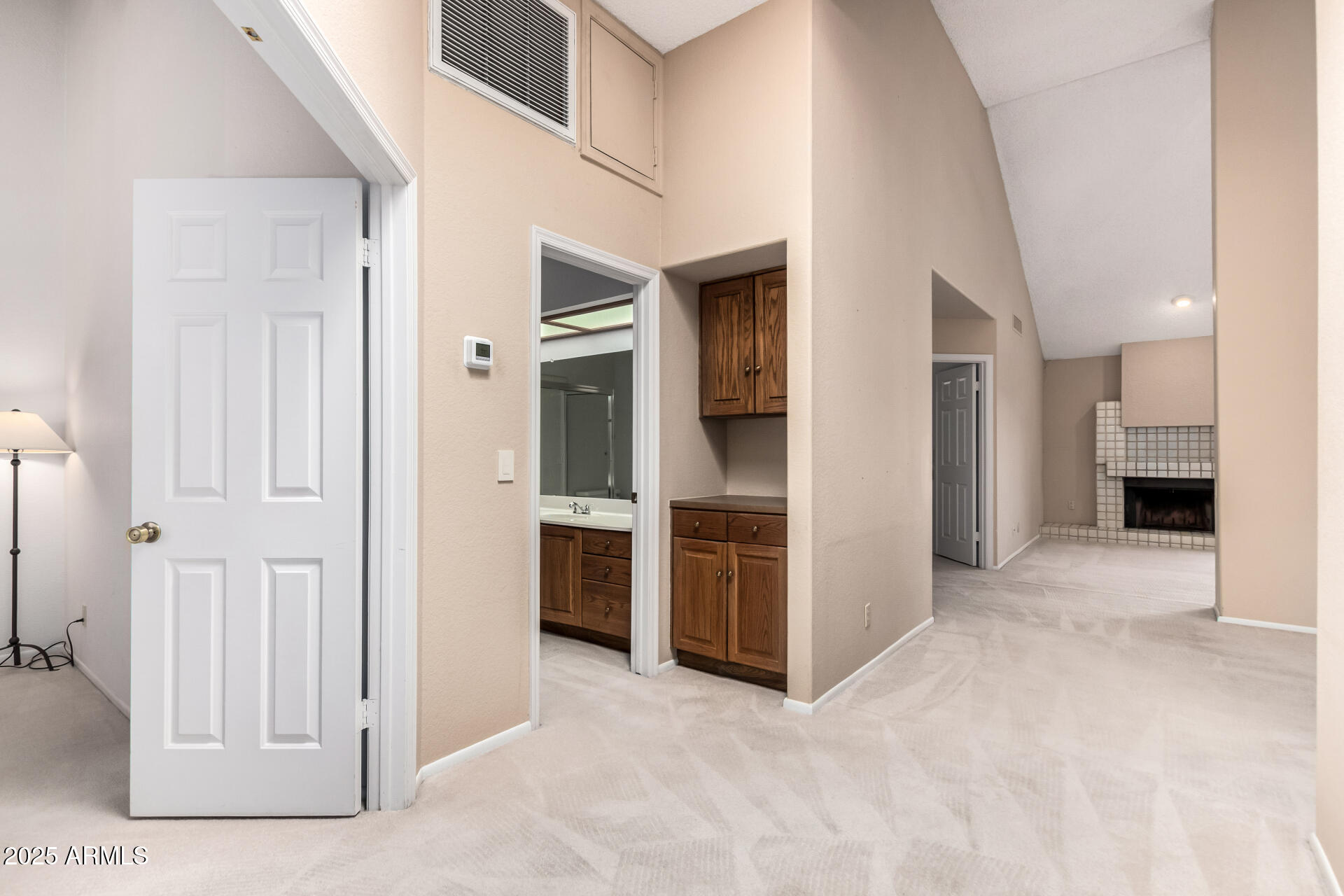 10019 East Mountain View Road, Unit 2114 Scottsdale, AZ 85258 - Photo 7 of 40 a view of a hallway with kitchen space and front door