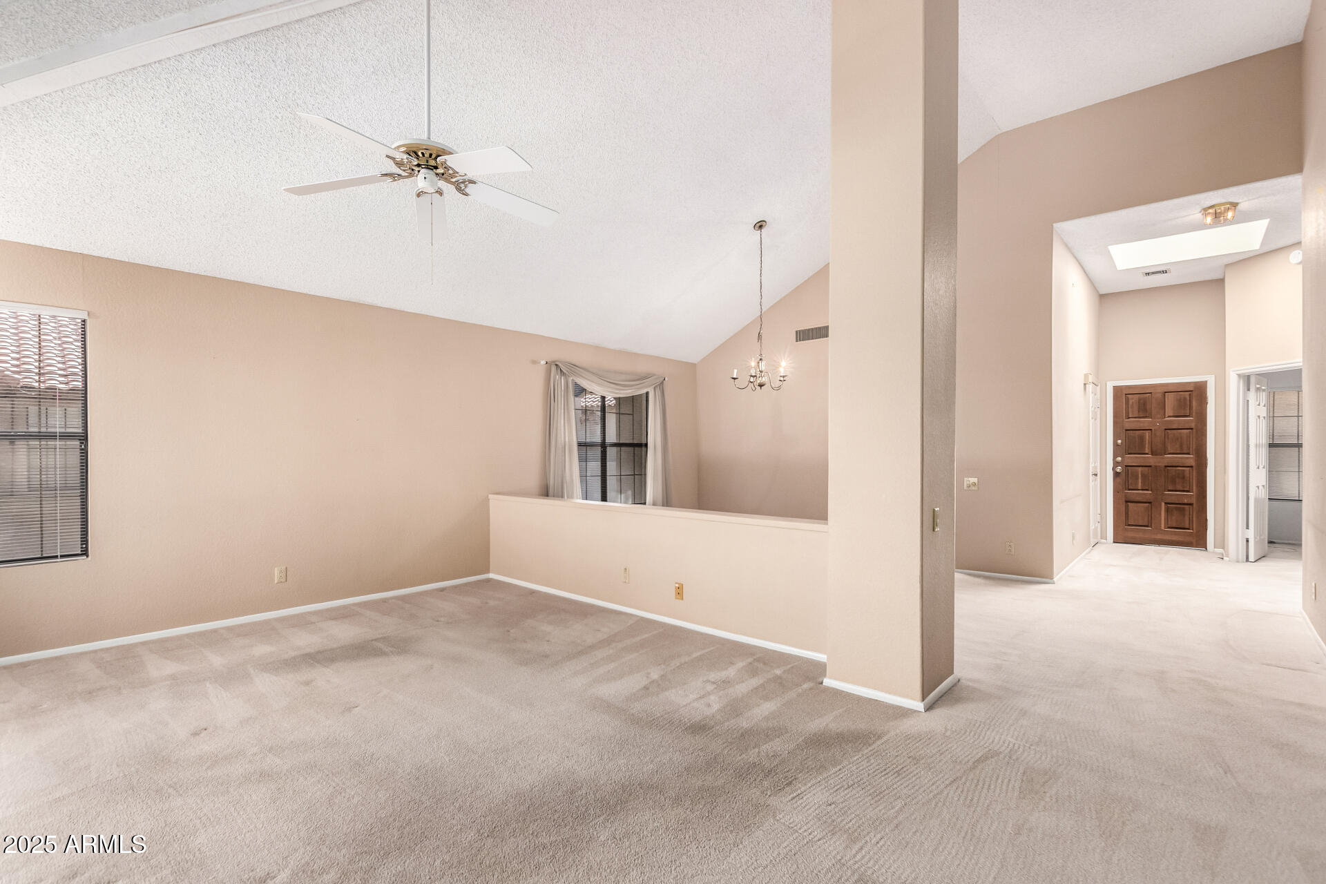 10019 East Mountain View Road, Unit 2114 Scottsdale, AZ 85258 - Photo 8 of 40 a view of an empty room with chandelier fan